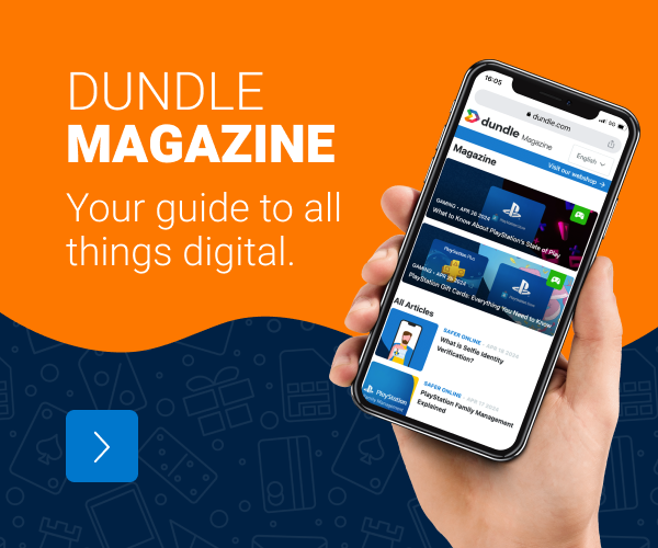 a hand holding a mobile phone opened on the dundle magazine page